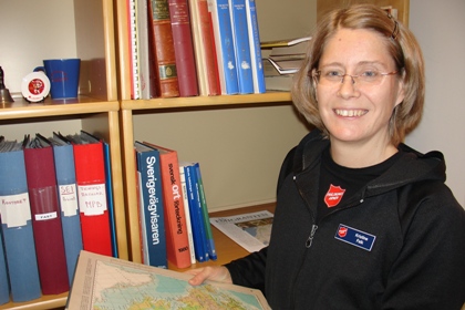 Kristine Falk bär glasögon och har kortklippt hår